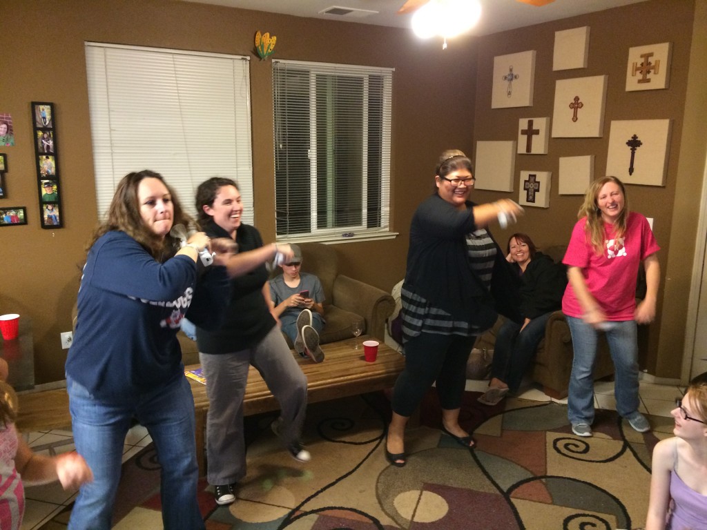 The ladies in a Wii dance-off. The guys just laughed...and took video for future reference...